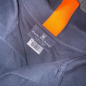 Psycho Bunny Dark Blue Polo with Vibrant Orange Stripe